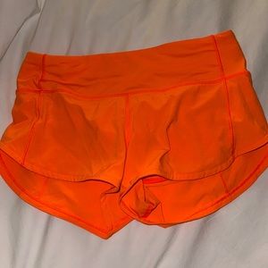 Orange Lululemon athletic shorts. Size 2.